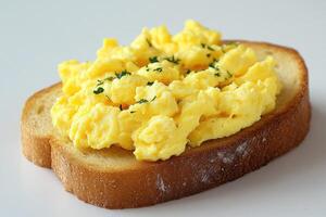 Scrambled eggs with parsley resting on toasted bread for a nutritious breakfast photo