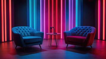 Two empty armchairs facing each other in a recording studio with colorful neon lights photo