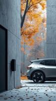 Electric car charging at home in autumn forest setting photo