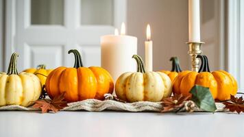 Autumnal Table Setting with Pumpkins and Candles photo