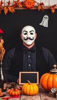 Mysterious Man in a Mask with Pumpkins and a Chalkboard photo