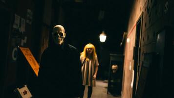 Man in a Skull Mask Stands in a Dark Hallway photo