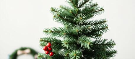 Close Up of a Christmas Tree Branch with Red Ornaments photo