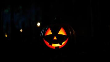 Illuminated Jack-O-Lantern In The Darkness photo