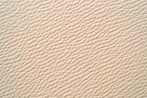 Elegant and warm leather surface with subtle textures in a light beige tone suitable for various design projects photo