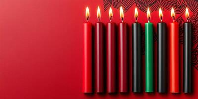 Kinara with seven candles symbolizing Kwanzaa displayed against a warm red background with African patterns photo