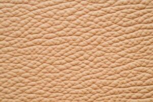 Elegant warm leather surface with soft light showcasing subtle textures in a soothing color palette photo