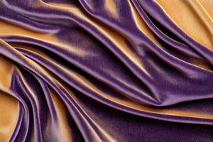 Luxurious dark purple and rich brown velvet fabric with soft light reflections creating a textured abstract background photo