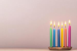 Kwanzaa Kinara with colorful candles symbolizing unity and hope on a simple background photo