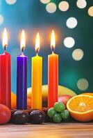 Kinara with lit candles and traditional symbols on a wooden table along with fruits in a festive setting photo