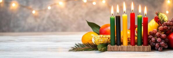 A Kinara with seven candles surrounded by Kwanzaa symbols on a festive table celebrating unity and tradition photo
