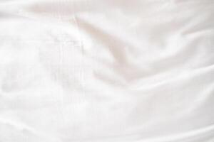 Abstract White Bedding Sheets or White wrinkled fabric background texture and Texture with copy-space Creased or wrinkled white fabric,Soft focus photo