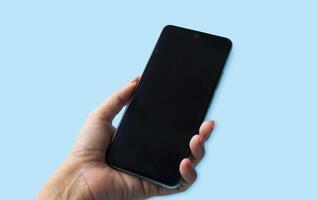 Hand is holding blank screen, the mobile phone is isolated background photo