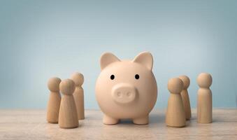 Wooden figures standing around dartboard and Pink piggy. Saving money concept. photo