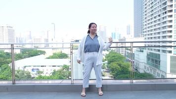 Asian fat woman with a bright face goes about her daily life, eating and walking happily. In the city and in buildings video