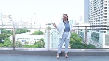 Asian fat woman with a bright face goes about her daily life, eating and walking happily. In the city and in buildings video