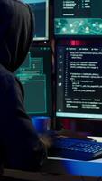 Vertical Evil cybercriminal using AI deep learning to produce virus corrupting data. Rogue programmer working on PC using artificial intelligence technology, penetrating security systems, camera A video