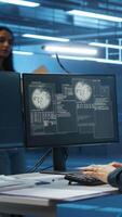 Vertical System administrator in server room workplace requesting assistance from colleagues during malware attack. IT support worker asking for help from colleagues to protect data center from hackers video