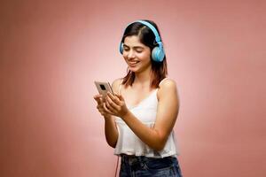 Pic Of Lady Smiling While Looking At Her Mobile Cellphone photo