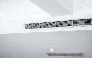 Air flow and ventilation system. Air Handling Units on ceiling walls for efficient cooling. Building ventilation. Air Handling Units and climate control systems. Ceiling-mounted ventilation units. photo