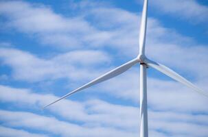 Wind energy and sustainable power generation with wind turbines, Eco-friendly solutions for renewable resources. Wind power farm and sustainable development of renewable energy, green technology. photo