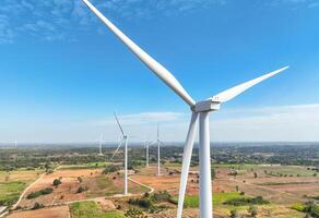 Wind energy and sustainable power generation with wind turbines, Eco-friendly solutions for renewable resources. Wind power farm and sustainable development of renewable energy, green technology. photo