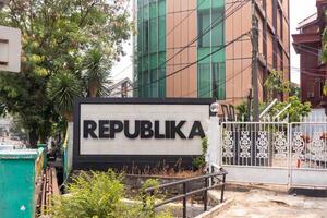 Jakarta, Indonesia, 2024 - Republika newspaper company signboard in front of office building. An Indonesian national daily newspaper. photo