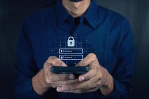 Man holding a smartphone to login username and password on screen. Data privacy online protection on mobile phone application. photo