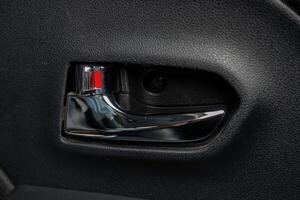 Inside metallic car door handle with open lock photo