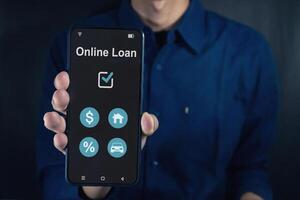 Man holding a smartphone with online loan application on screen. Financial lending by mobile application. photo