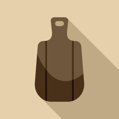 Brown wooden cutting board with long shadow on beige background