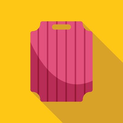 Pink plastic cutting board with handle on yellow background