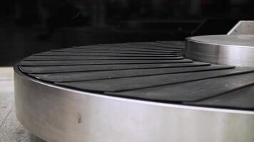 Moving empty baggage carousel at the airport video