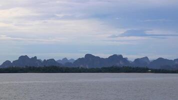 Tropical paradise turquoise water beach and limestone rocks Krabi Thailand. video