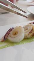 Chef Is Plating A Second Course Of Octopus Fish On A Cream Of Zucchini Base video