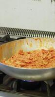 Chef Turns The Pan With Farfalle Pasta In Tomato Sauce In Kitchen video