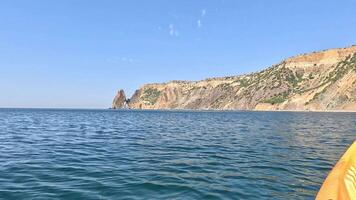 Sea Cliff Coastline Landscape - A panoramic view of the rocky coastline with a prominent sea cliff in the distance. video