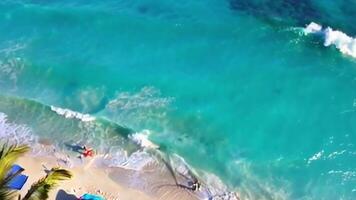 Sunny Beach with Crystal-Clear Turquoise Water Soft Sand and Slow-Motion Waves video