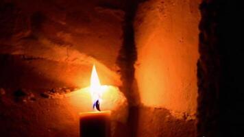 Candle Flame Flickering in the Dark with Shadows Cast on the Wall video
