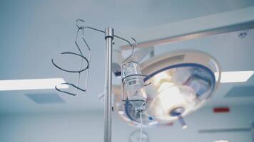 Anesthesia drop counter for patient in an operating room. Anesthesia bottle is hanging from a special support. Medical drop counter in surgical room. Close-up video