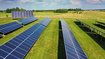 Alternative energy, view of solar panels in field. Solar energy at solar cell panels in a farm with sun lighting to create the clean electric power. video