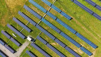 Aerial top view of solar power plant. Alternative clean electricity. Drone view of solar panels in the field. Motion up down. video