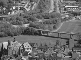An aerial view of a town with a bridge over it photo