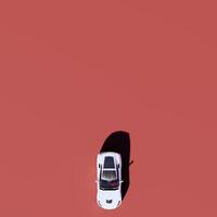 A car on a red background with a red background photo