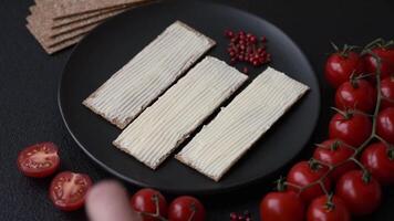 Rectangular whole grain crisp bread with cream cheese for a hearty, nutritious breakfast video