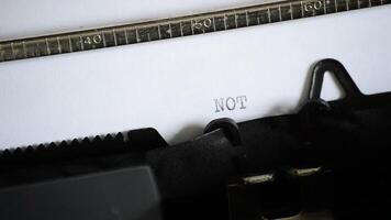 Typing the expression NOT GUILTY with an old manual typewriter video