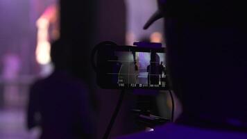 Man Filming Show While Standing Backstage During Performance video