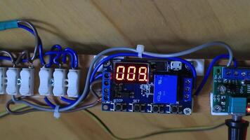 Electronic scoreboard with numbers counts down the time electronic modules are connected by wires, loop video