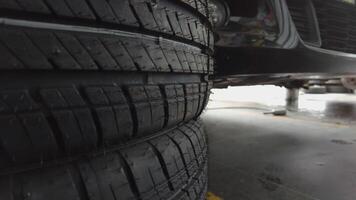 Car Removing Tire in the Auto Shop, Tires in auto parts store car care center. video