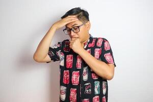 Studio shot of handsome Asian man having headache isolated against white background photo